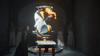 Eine Frau tanzt vor einem überdimensioniertem Robotergesicht. (verweist auf: Workshop 1 „Die GND nutzen“ im Forum Performing Arts)